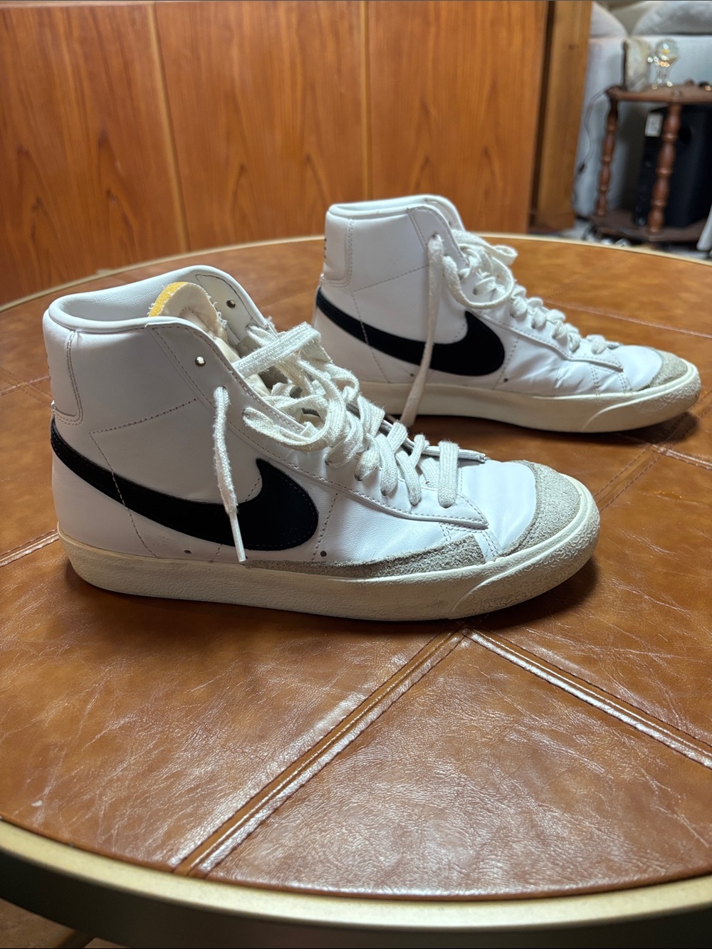 Nike White High-Top Sneakers with Black Swoosh